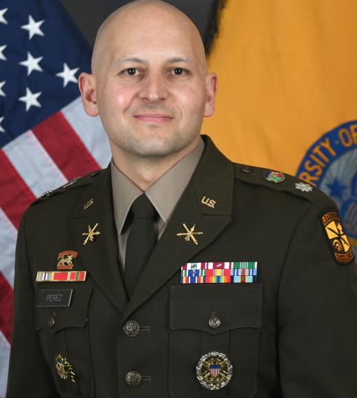 Matthew Perez smiling in his military dress clothes