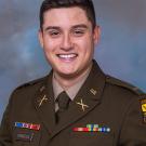 Andres Fonseca smiling in his military uniform