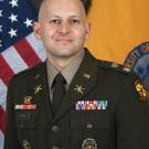 Matthew Perez smiling in his military dress clothes